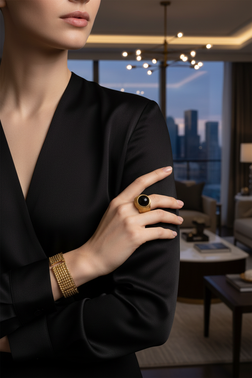 18K gold black onyx statement ring on hand, modern luxury jewelry lifestyle photo for Pinterest